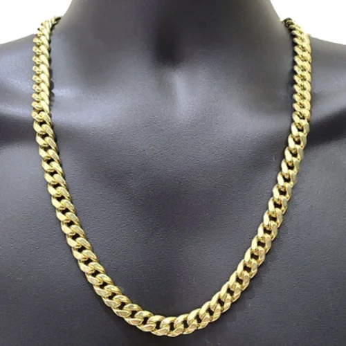 Gold Cuban chain on a black display bust